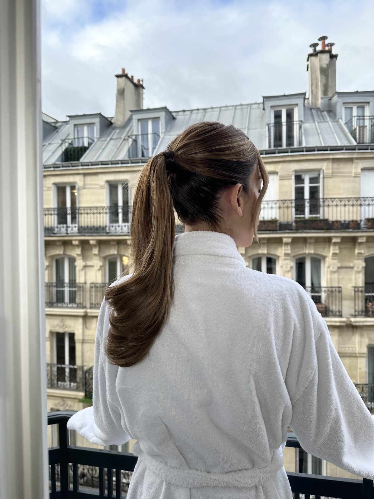 Getting ready on a Paris balcony, destination wedding hair by Andrada Rusu