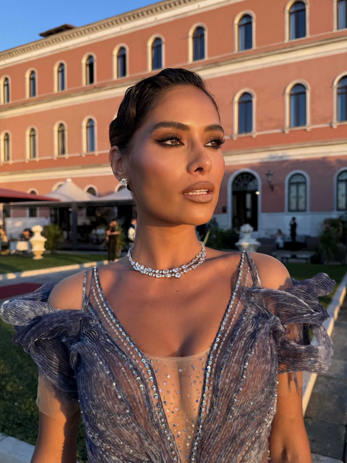 Coral one-shoulder gown at the Hotel Excelsior, Venice, hair and makeup by Andrada Rusu